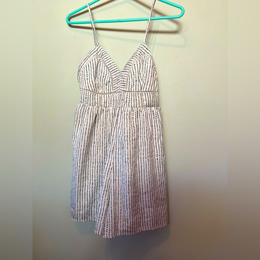 Japna size S, shorts romper, white with black detailing.